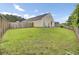 Spacious backyard featuring a lush lawn and a fire pit at 108 Larkspur Dr, Goose Creek, SC 29445