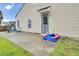 Backyard patio with a play table set, lawn, and home exterior view at 108 Larkspur Dr, Goose Creek, SC 29445