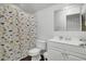 Bathroom features a dinosaur-themed shower curtain and white vanity at 108 Larkspur Dr, Goose Creek, SC 29445