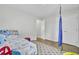 Bright bedroom featuring wood floors, a swing, closet and bed with cartoon character themed bedding at 108 Larkspur Dr, Goose Creek, SC 29445