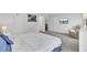 Bright bedroom with a comfortable chair, television, and neutral carpet at 108 Larkspur Dr, Goose Creek, SC 29445