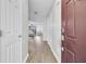 Bright entryway featuring wood-look floors, a view into the living spaces, and ample closet space at 108 Larkspur Dr, Goose Creek, SC 29445