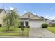 Charming single-story home with a manicured lawn and a two-car garage in a suburban neighborhood at 108 Larkspur Dr, Goose Creek, SC 29445
