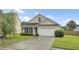 Charming single-story home with a manicured lawn and a two-car garage in a suburban neighborhood at 108 Larkspur Dr, Goose Creek, SC 29445