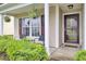 Inviting front porch with hanging ferns, seating, and a welcoming 'hello there' doormat at 108 Larkspur Dr, Goose Creek, SC 29445