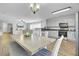 Bright kitchen features white cabinets, stainless steel appliances, and an open dining area with contemporary decor at 108 Larkspur Dr, Goose Creek, SC 29445