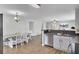 Open-concept kitchen with stainless steel appliances, a breakfast bar, and an adjacent dining area for seamless entertaining at 108 Larkspur Dr, Goose Creek, SC 29445