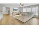Comfortable living room with wood floors, a sectional sofa, a ceiling fan, and a large window at 108 Larkspur Dr, Goose Creek, SC 29445