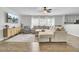Comfortable living room with wood floors, a sectional sofa, a ceiling fan, and a large window at 108 Larkspur Dr, Goose Creek, SC 29445