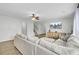 Comfortable living room with wood floors, a sectional sofa, a ceiling fan, and a large window at 108 Larkspur Dr, Goose Creek, SC 29445