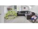 A playroom featuring a dark gray couch, play structure and an accent chair at 108 Larkspur Dr, Goose Creek, SC 29445