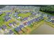Aerial view showcases house location in neighborhood with lake and green space nearby at 112 Whisper Dr, Summerville, SC 29485