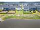Aerial view of the backyard with well-maintained lawn and a pond view, offering a serene outdoor setting at 112 Whisper Dr, Summerville, SC 29485