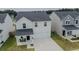 An aerial view showcasing this charming two-story home with a two-car garage and inviting front porch at 112 Whisper Dr, Summerville, SC 29485
