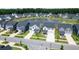 Beautiful aerial view of homes in a community surrounding a tranquil pond at 112 Whisper Dr, Summerville, SC 29485