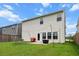 Lush backyard featuring a patio, fire pit, grill, and grassy area for outdoor enjoyment at 112 Whisper Dr, Summerville, SC 29485