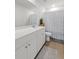 Bathroom with a double sink vanity, framed mirror, tile flooring, and a patterned shower curtain at 112 Whisper Dr, Summerville, SC 29485