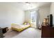 Bright bedroom with yellow twin bed, natural light, and carpet floors at 112 Whisper Dr, Summerville, SC 29485