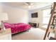 Bedroom with a pink bed, entertainment center, and carpet floors at 112 Whisper Dr, Summerville, SC 29485