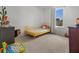 Bright bedroom with a yellow bed frame and decorative animal figures for a playful and inviting space at 112 Whisper Dr, Summerville, SC 29485