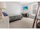 Comfortable bedroom with a mounted TV, wooden media console, and a window with natural light at 112 Whisper Dr, Summerville, SC 29485