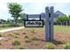 View of 'Azalea Ridge' community sign surrounded by well-maintained landscaping at 112 Whisper Dr, Summerville, SC 29485