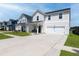Charming two-story home with neat lawn and driveway, showcasing curb appeal and inviting entrance at 112 Whisper Dr, Summerville, SC 29485