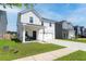 Charming two-story home with neat lawn and driveway, showcasing curb appeal and inviting entrance at 112 Whisper Dr, Summerville, SC 29485