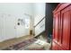 Bright foyer with a statement rug, stylish decor, and easy access to the staircase and main living areas at 112 Whisper Dr, Summerville, SC 29485