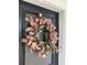 Black front door featuring an attractive autumn-toned wreath at 112 Whisper Dr, Summerville, SC 29485