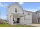 Inviting two-story home with a covered porch, classic columns, and a two-car attached garage at 112 Whisper Dr, Summerville, SC 29485