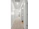 Bright hallway leading to various rooms, including a bathroom and a living area with natural light at 112 Whisper Dr, Summerville, SC 29485