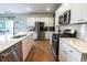Bright and modern kitchen featuring stainless steel appliances, white cabinets, and granite countertops, for an elegant feel at 112 Whisper Dr, Summerville, SC 29485