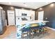 Bright kitchen features a large island with barstool seating, stainless steel appliances, and ample cabinet space at 112 Whisper Dr, Summerville, SC 29485