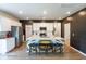 Spacious kitchen with stainless steel appliances, a central island with barstools, and ample storage in a modern design at 112 Whisper Dr, Summerville, SC 29485
