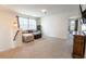 Inviting living room featuring a comfortable seating area, natural light, and neutral carpeting for a cozy and relaxing space at 112 Whisper Dr, Summerville, SC 29485