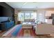 Cozy living area featuring a plush sectional sofa, a modern TV console, and an abundance of natural light at 112 Whisper Dr, Summerville, SC 29485