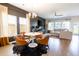 Spacious living area with an accent wall, modern lighting, and comfortable seating perfect for entertaining guests at 112 Whisper Dr, Summerville, SC 29485