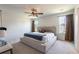 Spacious main bedroom with a ceiling fan, carpet, and a cozy bed at 112 Whisper Dr, Summerville, SC 29485