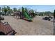 Community playground with slides and benches in a landscaped area at 112 Whisper Dr, Summerville, SC 29485
