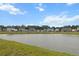 Picturesque pond view showcasing a community with well-maintained homes and beautiful landscaping at 112 Whisper Dr, Summerville, SC 29485