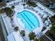 Aerial view of a modern pool surrounded by palm trees, loungers and pergolas at 112 Whisper Dr, Summerville, SC 29485