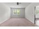 Bright bedroom with neutral carpet, a ceiling fan, and large windows offering plenty of natural light at 113 Petrell Rd, Summerville, SC 29483