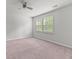 Simple yet bright bedroom featuring neutral carpet, a ceiling fan, and large windows at 113 Petrell Rd, Summerville, SC 29483