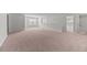 Large bonus room or loft area with neutral carpet, white walls, and large windows for natural light at 113 Petrell Rd, Summerville, SC 29483
