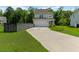 Exterior view of a two-story home featuring a concrete driveway, attached garage, and manicured lawn at 113 Petrell Rd, Summerville, SC 29483