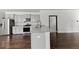 Modern kitchen with granite countertops, stainless steel appliances, gray cabinets, and hardwood floors at 113 Petrell Rd, Summerville, SC 29483