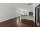Spacious kitchen area with granite countertops, hardwood floors, a breakfast bar, and a door to another room at 113 Petrell Rd, Summerville, SC 29483