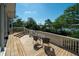 Inviting deck with wood flooring and white railings, perfect for relaxing and enjoying water views at 1195 Framptons Inlet Rd, Edisto Island, SC 29438