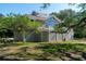 Spacious exterior home view showcases beautiful design, deck and backyard space at 1195 Framptons Inlet Rd, Edisto Island, SC 29438